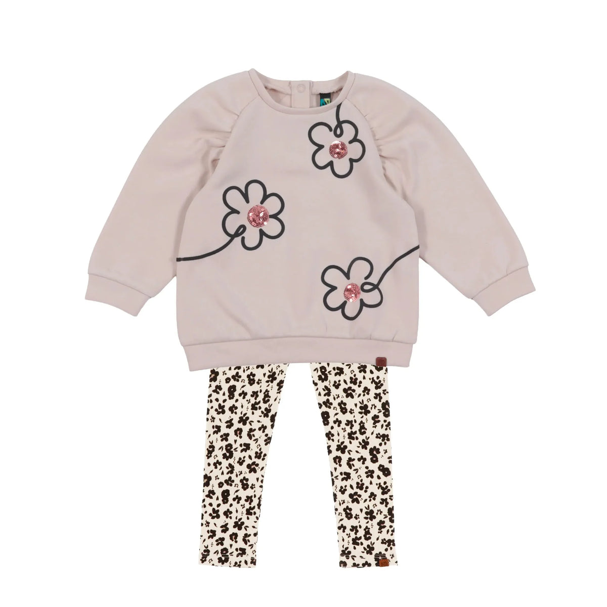 A children's two-piece outfit featuring a light pink sweatshirt with black outlined flower graphics and pink sequined flower centers, paired with cream leggings with a black floral  print pattern.