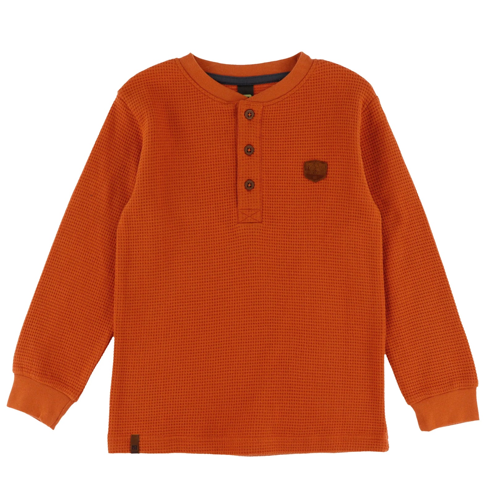 An orange waffle-knit long-sleeve henley shirt with three buttons on the chest and a small brown shield logo on the left chest, displayed flat against a white background.